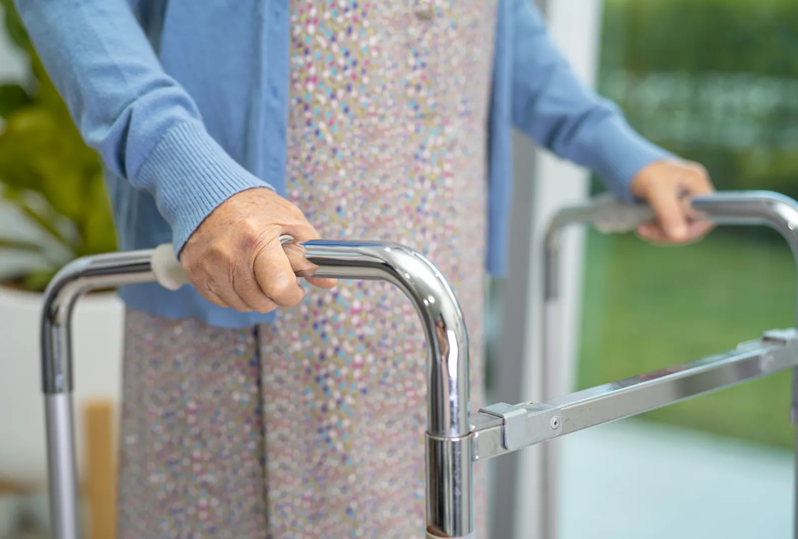 elderly woman resting on a walker